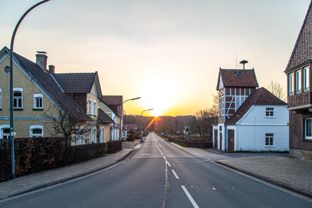 asphalt-road-town-sunset-rural-landscape